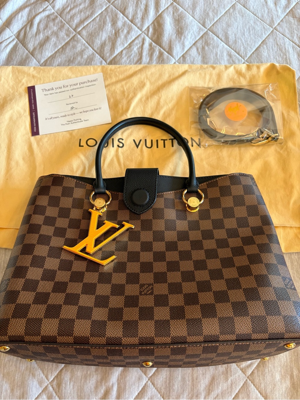 Louis Vuitton Brown Damier Ebene Tote with Gold LV Charm.